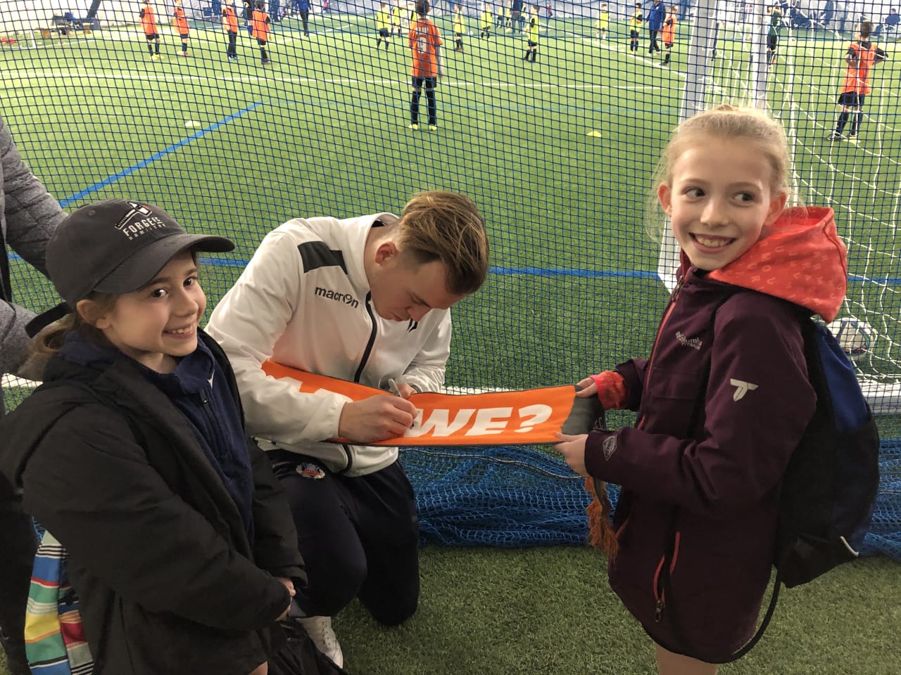 Player sigining kids scarf