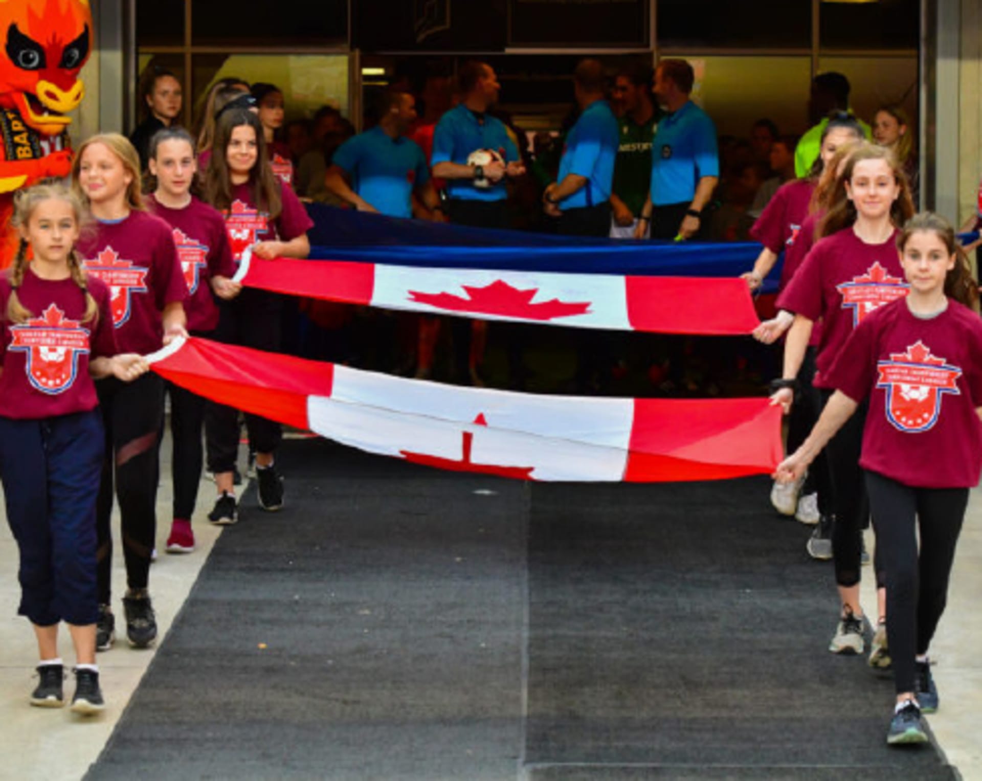 Kids carrying flag out to field