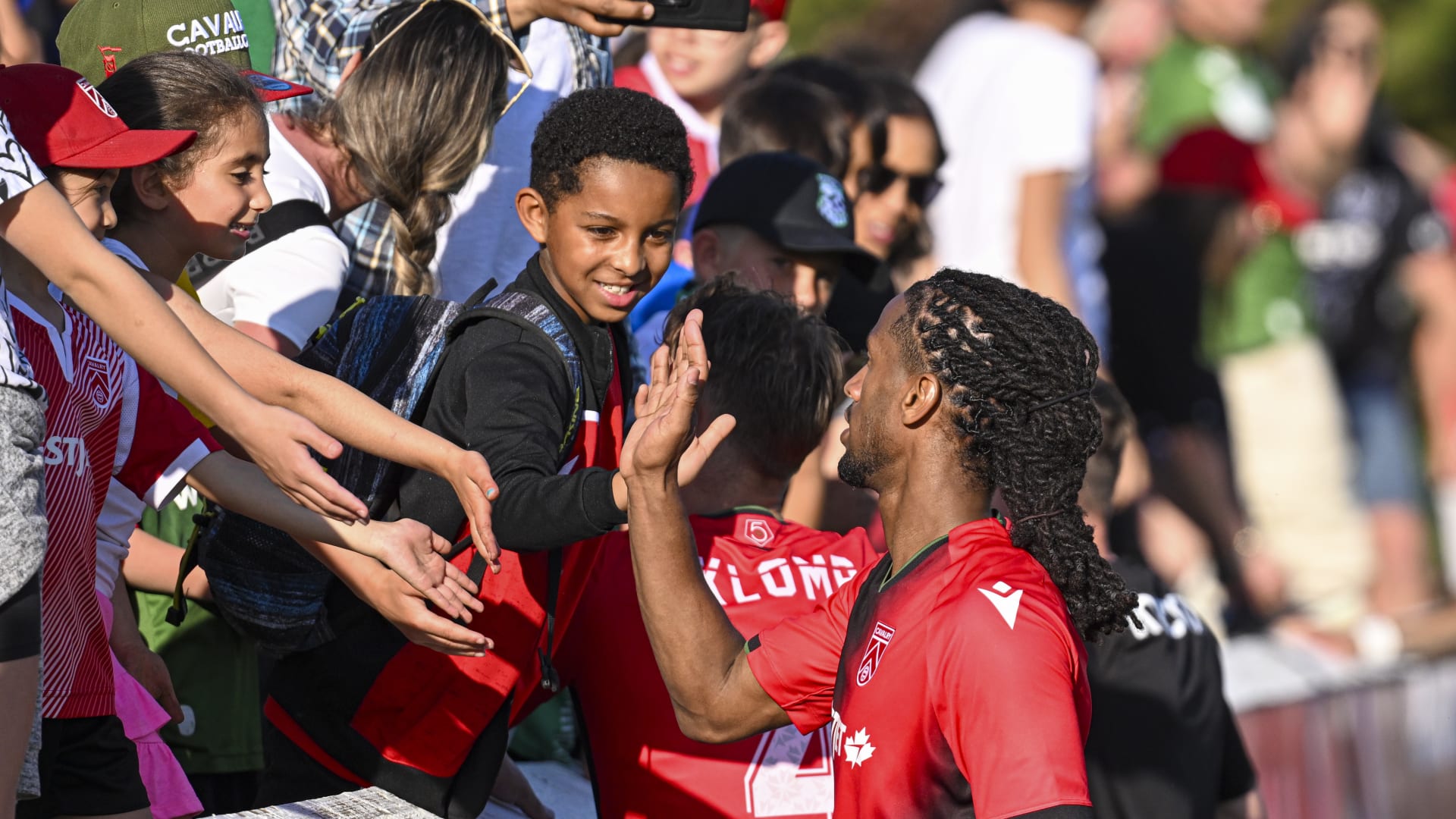 Ali Musse with Young Fans